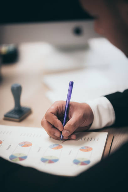 istock Business people are checking marketing documents 1214069044