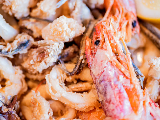 istock Typical Italian dish, mixed fried fresh fish with squid rings, sardines and shrimp 1214070865