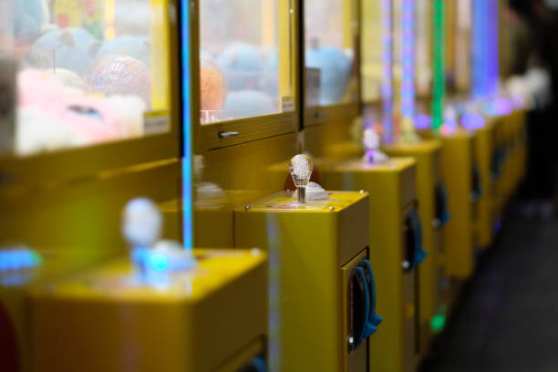 istock close up a row of claw crane machine. 1214072363