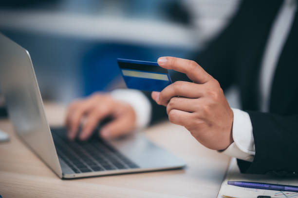 istock businessman working with credit card and laptop 1214072642