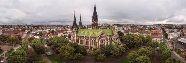 Beautiful 180 degrees panoramic landscape of Lviv city with old Neo-Gothic style church of Sts. Olha and Elizabeth. Aerial drone view of old tourist European city