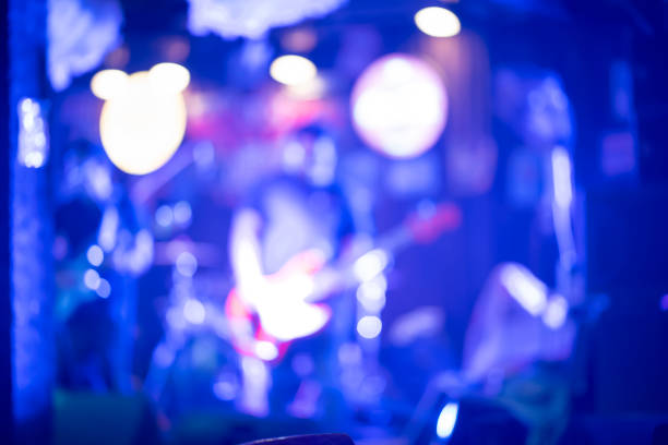 istock abstract blurry of musical playing guitar in pub 1214074290