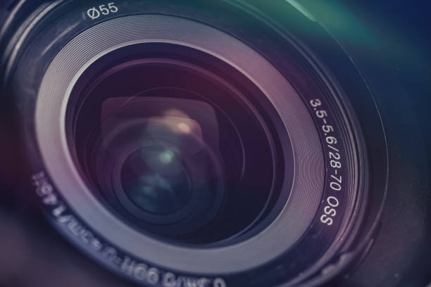 istock Beautiful camera lens with multi colored light of glass. Background pattern for design. 1214075861
