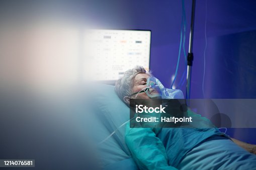 istock Infected patient in quarantine lying in bed in hospital, coronavirus concept. 1214076581