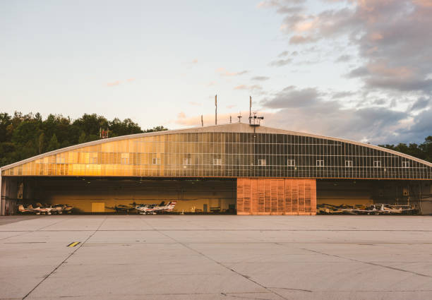 istock Small plane parked at the airport hangar 1214078002