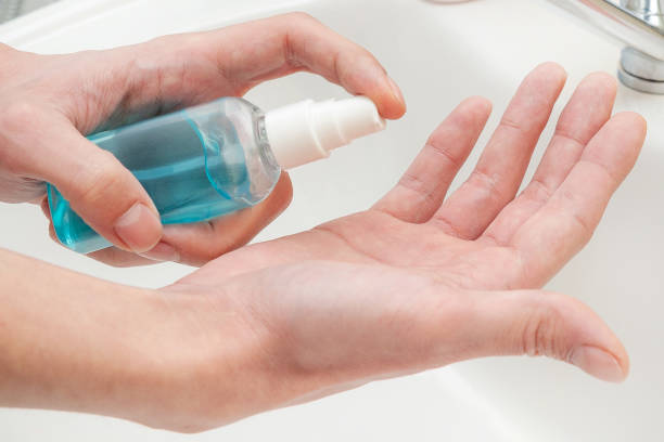 istock Hand treatment with antiseptic. Antibacterial protection and self-care. 1214079773