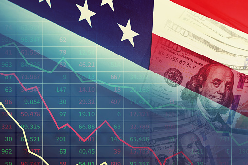 Economic and financial crisis concept. Stock market graphs and usd dollar against ameican flag on dark background
