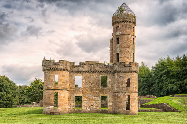 Irvine, Scotland, UK - September 18, 2017: Eglinton castle Ruins taken on a cloudy day before it rained. Surrounded by trees it is situated with the Eglinton park Irvine Scotland