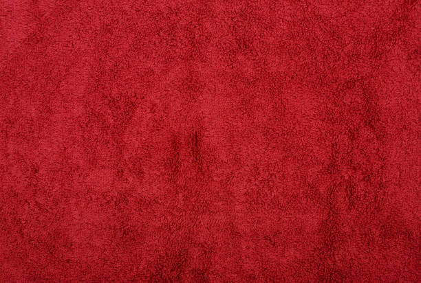 istock The red terry towel as a background. 1214082783