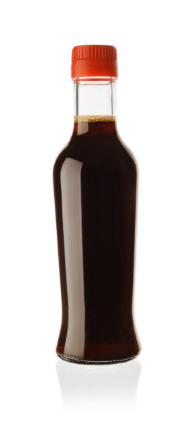 istock Soy sauce in a glass bottle isolated. 1214083179