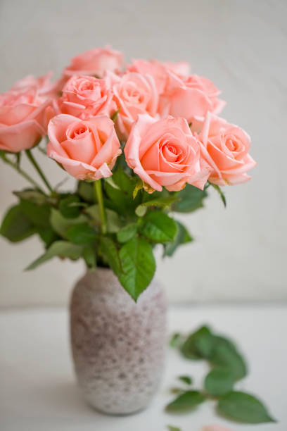 istock Pink roses bouquet in a vase 1214084150
