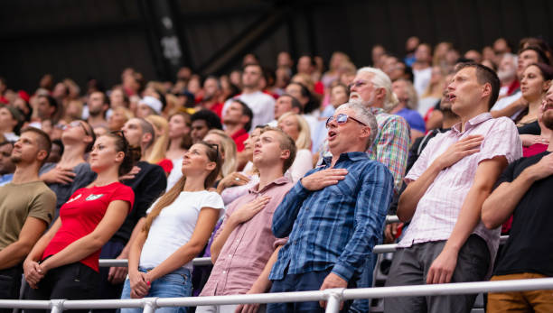 istock People During National Anthem On A Sports Event 1214084754