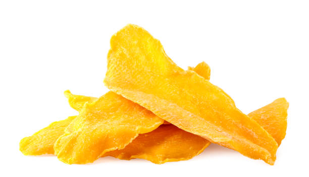 istock A pile of dried mango slices close-up on a white. Isolated 1214086067
