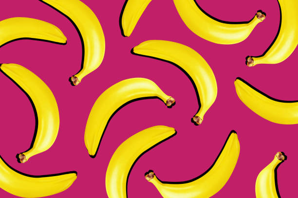 istock Top view. Yellow bananas on pink background. 1214086672