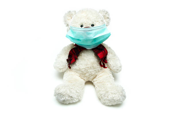 istock The plush teddy bear with a mask on his face 1214088483