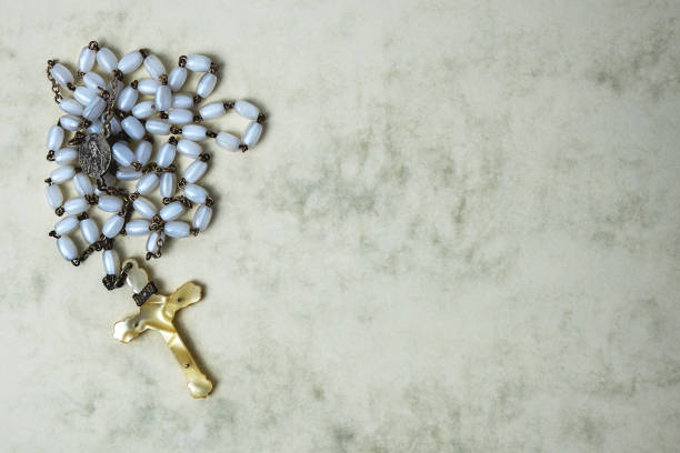istock antique rosary on marbled paper background 1214089035