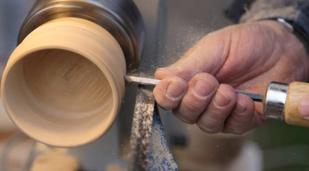 istock craftsman with the chisel during the work of the wood 1214091016