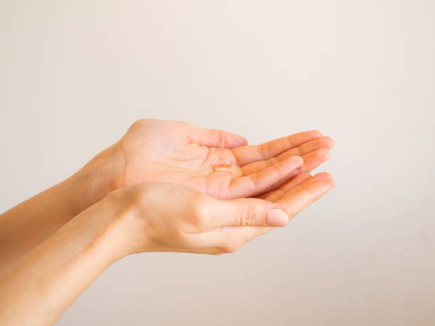 istock Female hands cleaning with sanitizer gel 1214092317