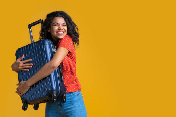 istock Beautiful dark skinned female tourist isolated on bright colored background 1214094507