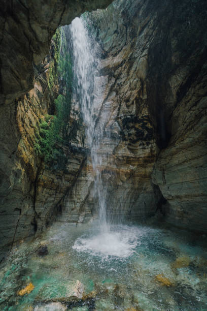 istock Scenic view of waterfall in the cave 1214094732