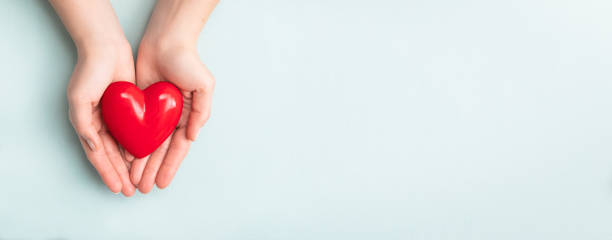 istock The woman is holding a red heart. 1214096914