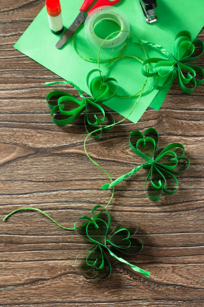 istock Garland St. Patrick's Day clover, craft from paper. Handmade. Children's art project, needlework, crafts for children. 1214097246