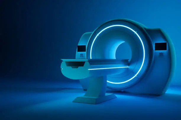 Photo of MRI machine, magnetic resonance imaging machine on a dark blue background. Concept medicine, technology, future. 3D rendering, 3D illustration, copy space.