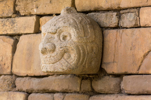 Cabeza Clava or pre-incan sculpture in Peru Closeup of a Nail head (Cabeza Clava) or zoomorphic face carved in stone  from the pre-incan culture Chavin in Ancash Region, Peru huari stock pictures, royalty-free photos & images