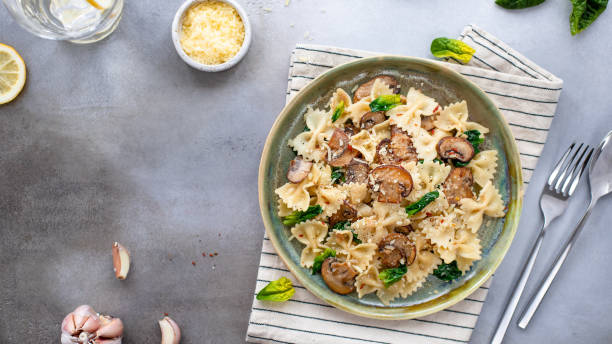 istock tasty pasta with mushrooms and spinach 1214099751