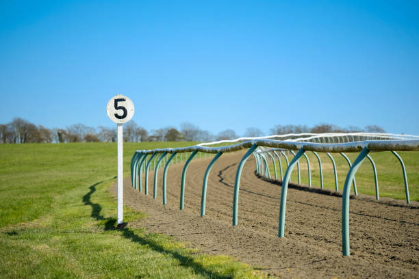 shallow focus of a 5 furlong sign post seen at the edge of a bend at a horse rack track seen near a famous english market town. - ascot imagens e fotografias de stock