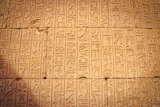 Ancient Egyptian writing, Egyptian hieroglyphs, wall inscriptions Ancient Egyptian writing, Egyptian hieroglyphs.Hieroglyphics shot in the ruins of the temple of Dendera or the Temple of Hator, Egypt, near the city of Ken. hieroglyphics photos stock pictures, royalty-free photos & images