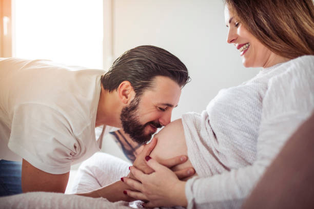 Happy pregnant woman with her man stock photo