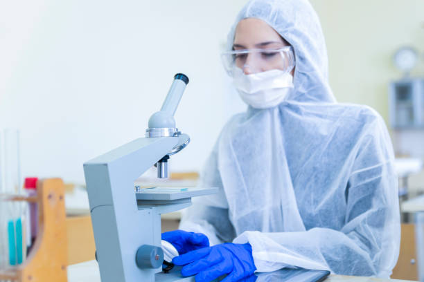 istock Laboratory student examines cells with cancer status. 1214102745