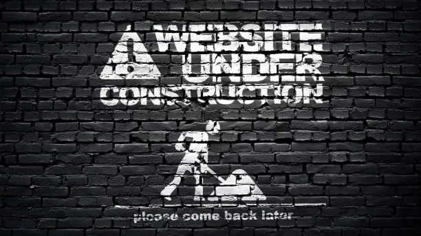 Website graphic, page under construction, white text on black brick wall