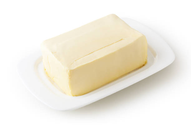 istock Fresh butter on white butter dish isolated on white background with clipping path 1214104573