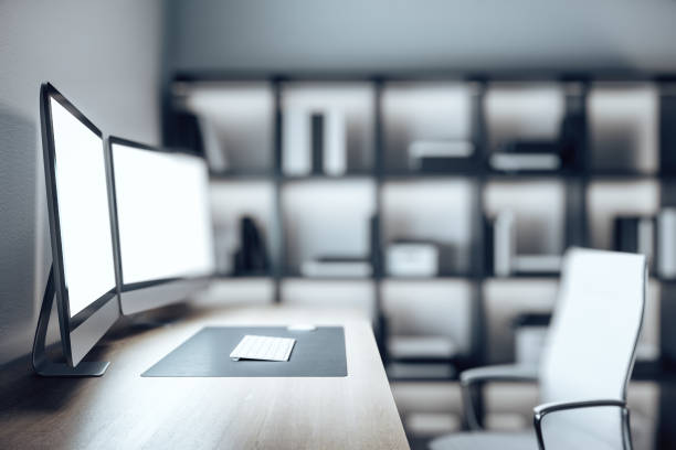 istock Coworking designer desktop with two empty monitor 1214104584