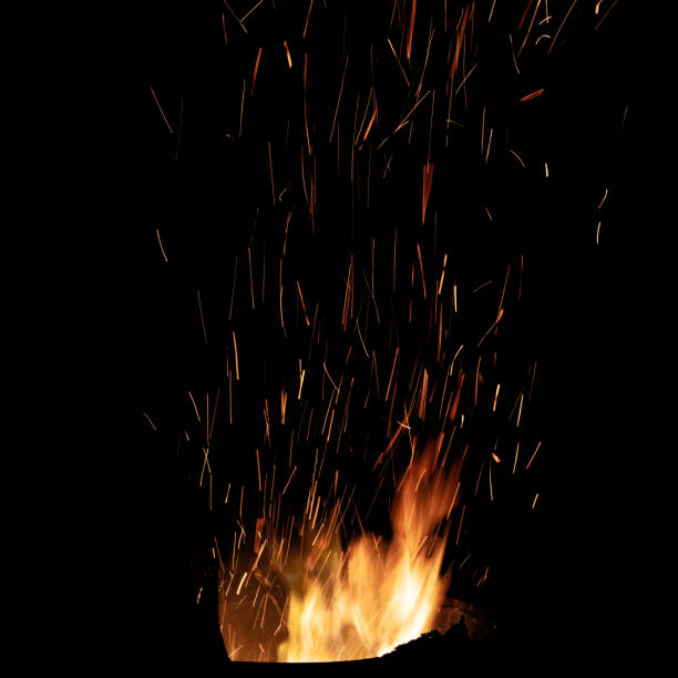 istock Bonfire flame with bright sparks. Isolated on black background 1214107026