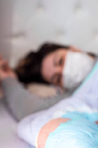 istock Blurred image of patient lying due to epidemic virus 1214111365
