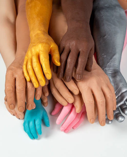 Two Multi Color painted hands coming to each other.