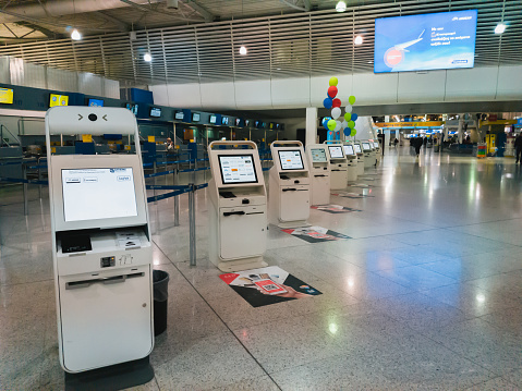 Athens, Greece - February, 11 2020: A self service check-in machines for check in and printing boarding pass in the empty main terminal of Athens International Airport Eleftherios Venizelos.