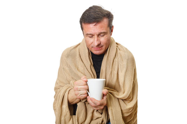 istock Adult man warms himself with a warm blanket 1214118185