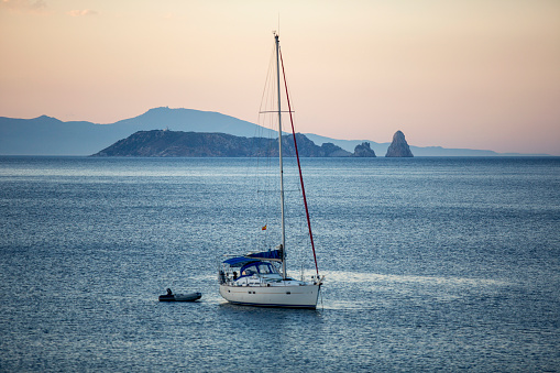 Sailboat navigating the sea in front of Begur, Catalunya, Spain