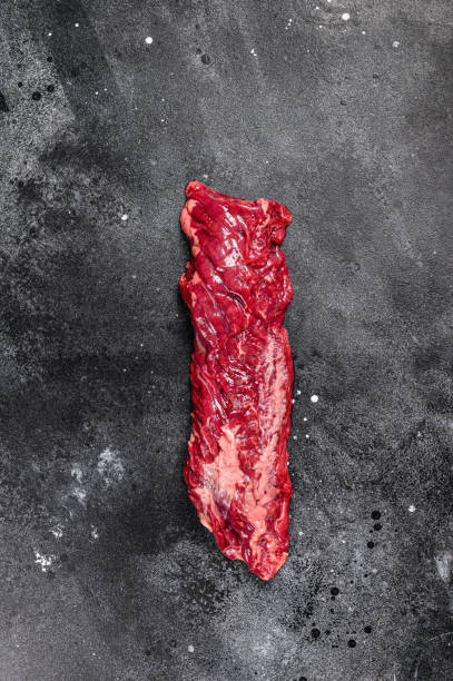 istock Raw skirt, machete steak. Black background. Top view 1214119592