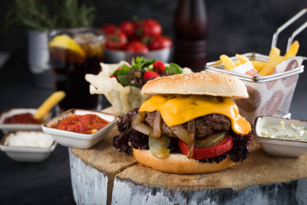 istock cheeseburger on wood with fries 1214120570