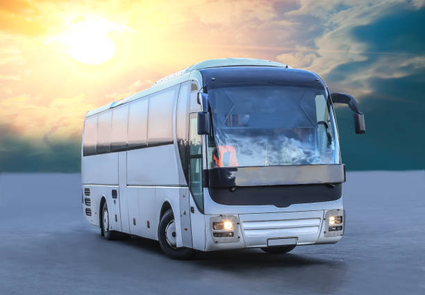istock bus on asphalt in the evening on sunset 1214120596