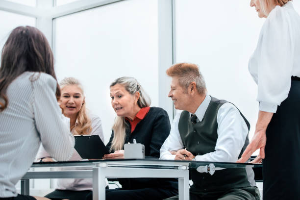 istock working group discusses the current tasks at a meeting in the office. 1214124312