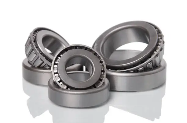 Three tapered roller bearings isoleted on white background