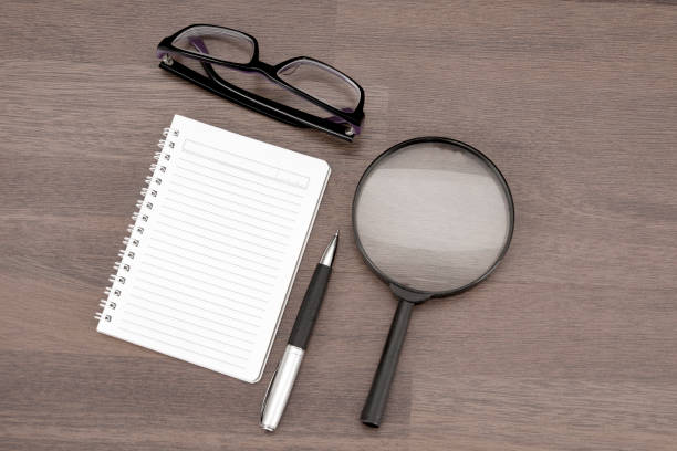 istock ring binder and magnifying glass on the desk 1214129864