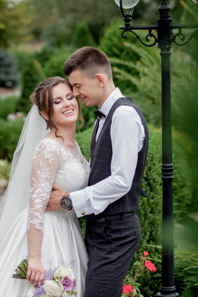 istock Bride and groom in forest on their wedding, photo session. 1214130131