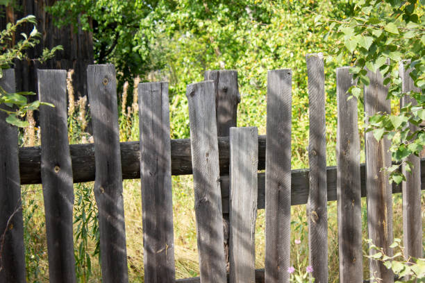 istock Background of an old crooked fence 1214132189